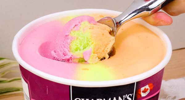 a scoop of Chapman's Rainbow Sorbet out of a tub