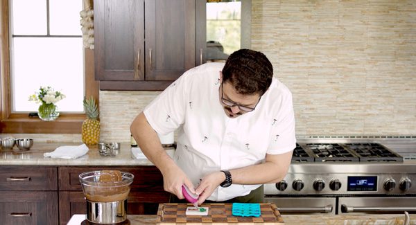 Squeezing chocolate in to the mold