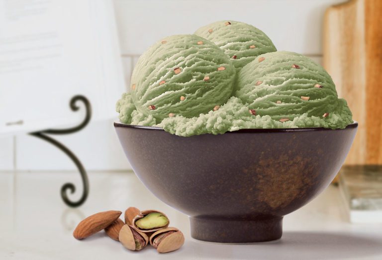 Bowl of Pistachio and Almonds Ice Cream sitting on a kitchen counter