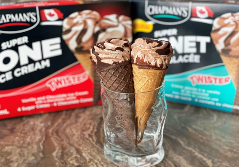 Two Twister Ice Cream Cones in a glass cup on a tabletop