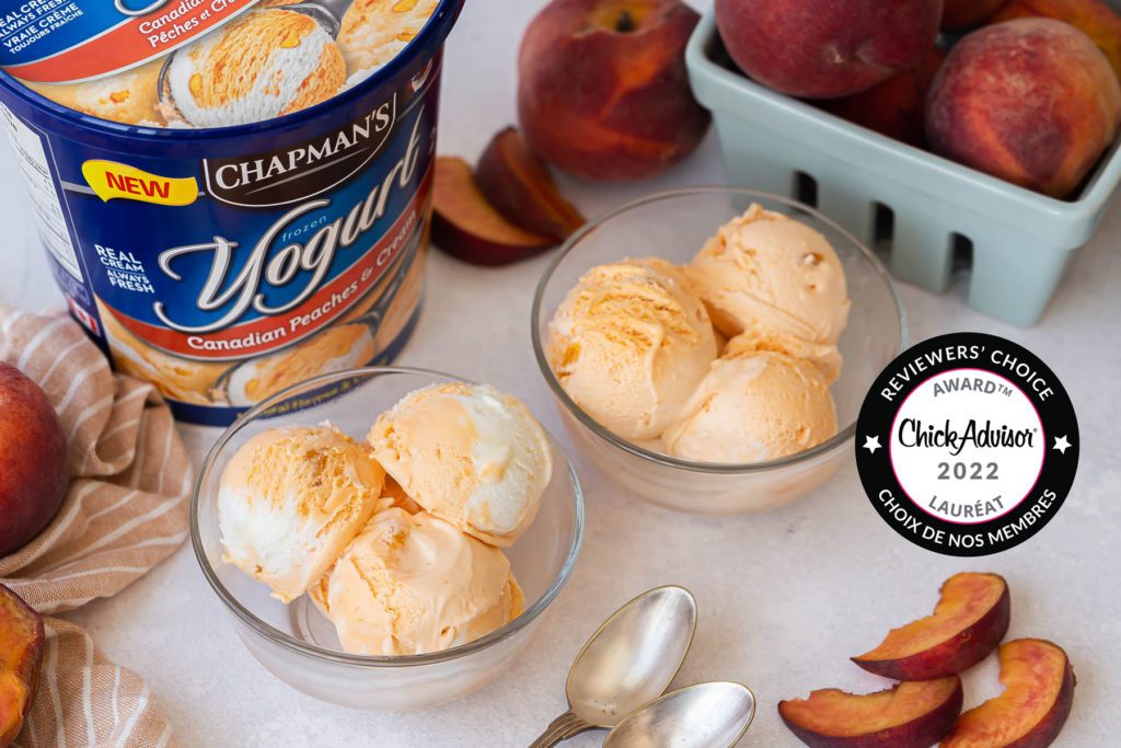 two clear glass bowls each with three scoops of Chapman's award-winning Peaches & Cream Frozen Yogurt