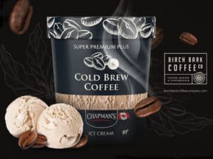 A tub of Chapman's Super Premium Plus Cold Brew Coffee ice cream with two ice cream scoops in front. Beside is the Birch Bark Coffee Co. logo.