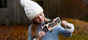 Girl holding Chapman's coupon